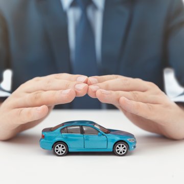 powertrain warranty car what is it man in suit covering with hands blue toy car